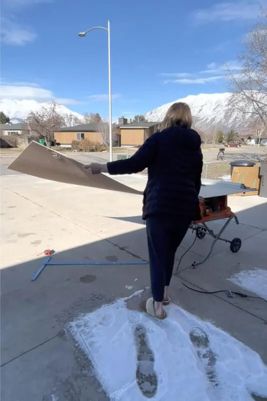 Using a table saw to cut plywood.